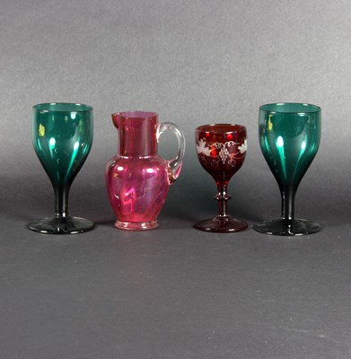 Lot 30 - A pair of green glass goblets, 13cm high, a...