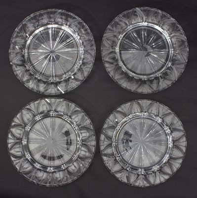 Lot 47 - A set of four clear glass plates, deeply cut...