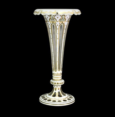 Lot 54 - A Bohemian white overlay glass vase of trumpet...