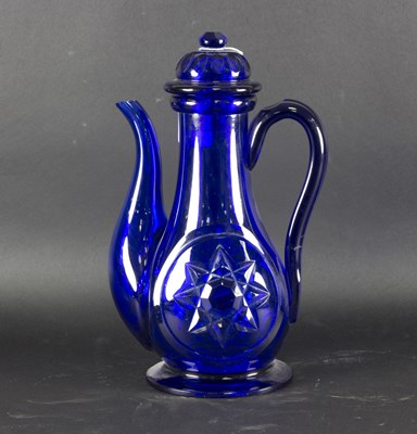 Lot 56 - A Bohemian blue glass ewer and cover, circa...