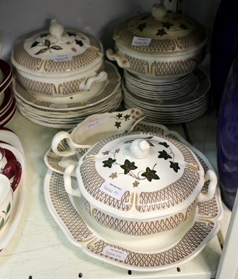 Lot 104 - A Wedgwood Avocado pattern part dinner service...