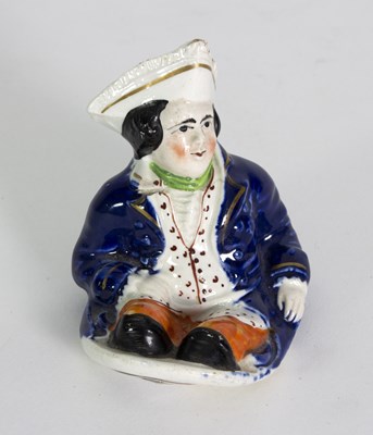 Lot 128 - A Staffordshire figure of a naval captain,...