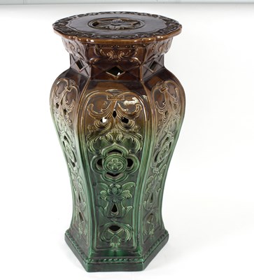 Lot 132 - A pottery glazed jardini?re stand with pierced...