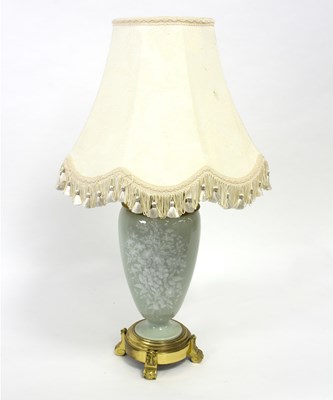 Lot 160 - A pate-sur-pate decorated lamp, with flowers...