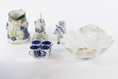 Lot 165 - A Staffordshire blue and white cow creamer and...