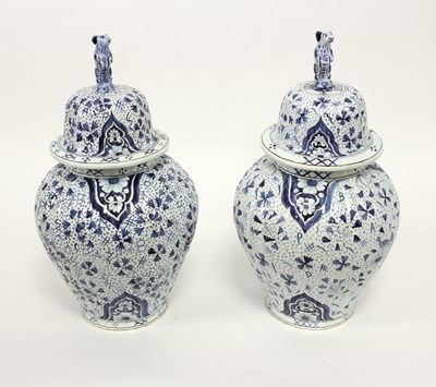 Lot 168 - A pair of modern blue and white Delftware jars...