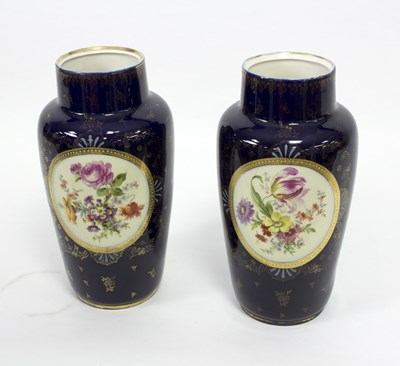 Lot 169 - A pair of Vienna style dark blue ground vases,...