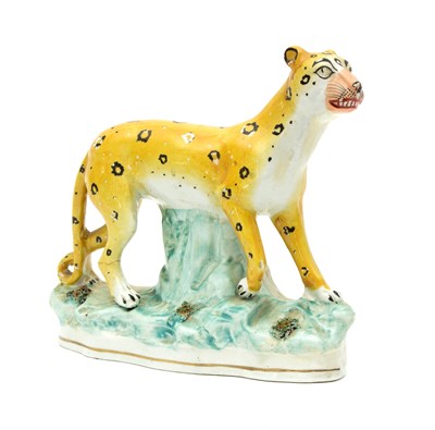 Lot 173 - A Staffordshire figure of a leopard, 19th...