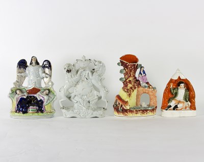 Lot 174 - A group of Staffordshire pottery figures,...