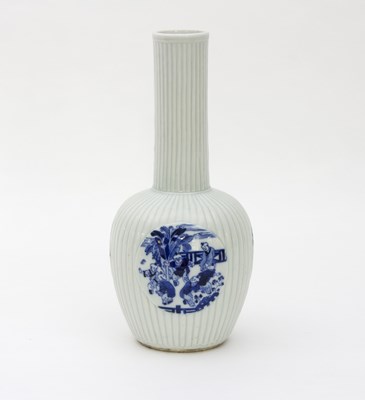 Lot 206 - A Chinese porcelain ribbed vase with three...