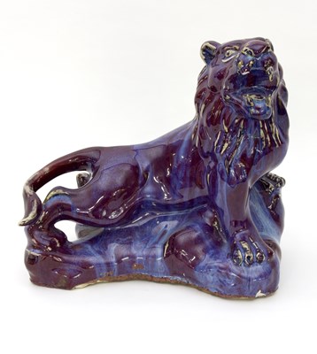 Lot 207 - A Chinese purple glaze figure of a lion,...