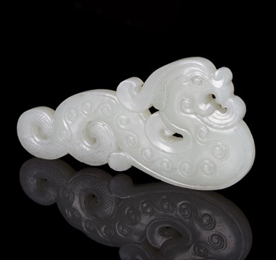 Lot 211 - A Chinese white jade phoenix pendant, carved...