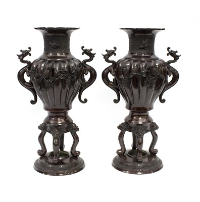 Lot 216 - A pair of Japanese bronzed urns with reeded...