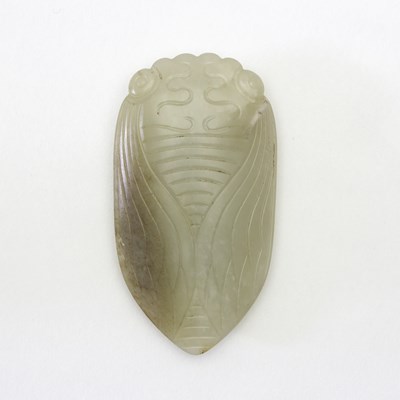 Lot 218 - A Chinese white and russet jade carving of a...