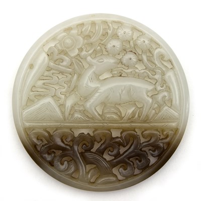 Lot 221 - A Chinese white jade carving of circular form...