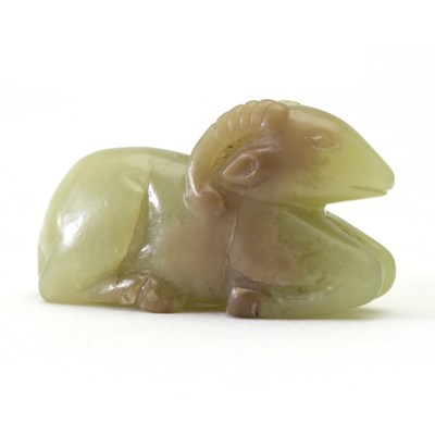 Lot 224 - A Chinese yellow jade carving of a ram, carved...