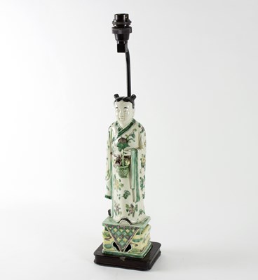 Lot 230 - A Chinese porcelain figure of an immortal,...