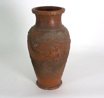 Lot 238 - A Chinese earthenware vase decorated a dragon...