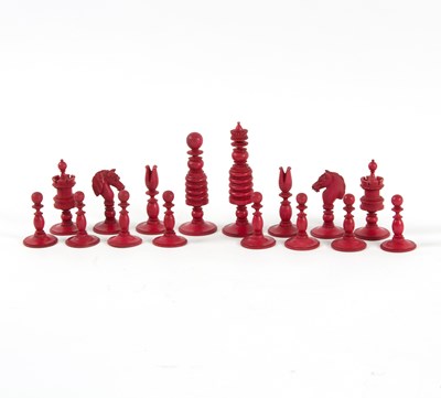 Lot 239 - A red and white stained ivory chess set