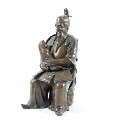 Lot 250 - A Japanese bronzed metal figure of a samurai,...