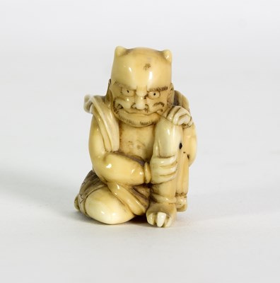 Lot 252 - A Japanese carved walrus ivory figure of a...