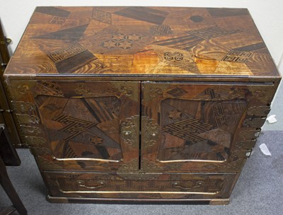 Lot 333 - A Japanese inlaid chest with panel doors...