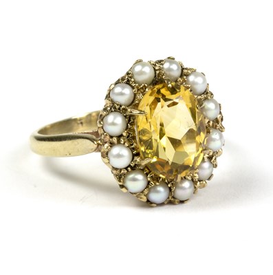 Lot 398 - A citrine and seed pearl cluster ring, in a...