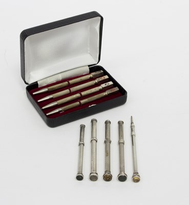 Lot 406 - Five silver propelling pencils, makers to...