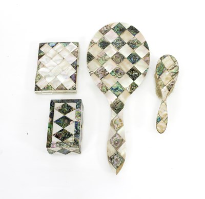 Lot 427 - A mother-of-pearl and abalone backed hand...