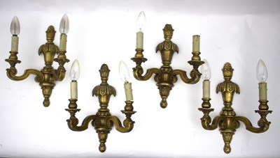 Lot 457 - A set of four gilded wall lights