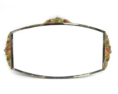 Lot 459 - A frameless wall mirror, the border with...