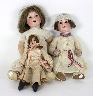 Lot 512 - A German bisque head doll with stuffed body,...