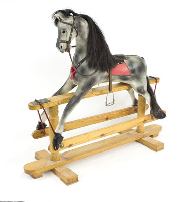 Lot 513 - A child's painted and decorated rocking horse...