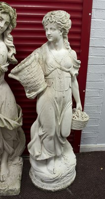 Lot 523 - A reconstituted stone garden statue of a girl...