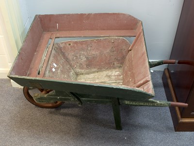 Lot 525 - A child's painted wheelbarrow, 103cm long