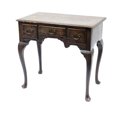 Lot 536 - A George III style oak lowboy on cabriole legs,...