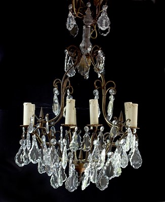 Lot 538 - A twelve-branch eight-light chandelier hung...