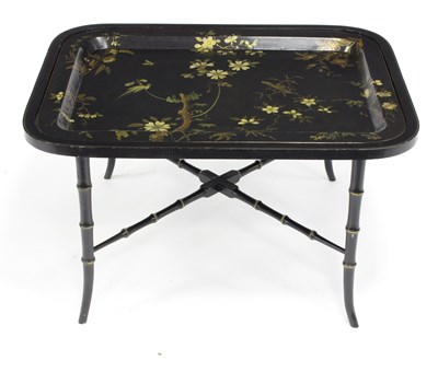 Lot 541 - A japanned lacquered tray with gilt floral...