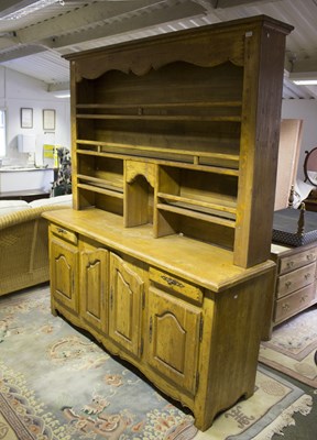 Lot 550 - An oak dresser with open rack above drawers...