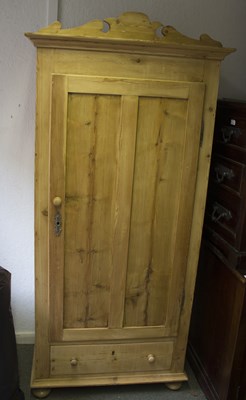 Lot 551 - A pine single wardrobe, on bun feet, 85cm wide