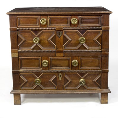 Lot 570 - A 17th Century oak chest of four panelled...