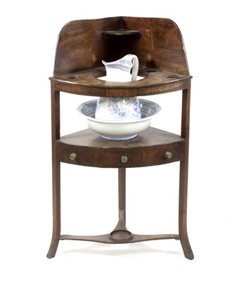 Lot 571 - A George III mahogany corner washstand with...