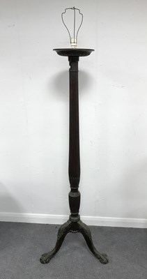 Lot 587 - A mahogany torchere with reeded column on a...