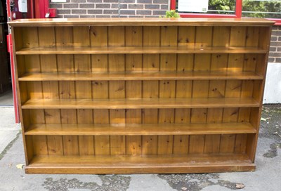 Lot 591 - A large mahogany open bookcase of five shelves,...