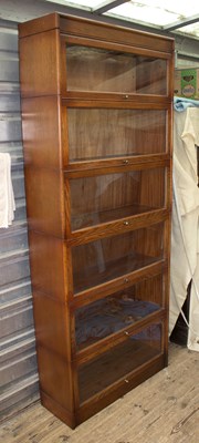 Lot 593 - A Globe Wernicke style stacking bookcase of...