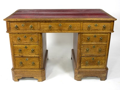 Lot 611 - A late 19th Century oak pedestal desk fitted a...