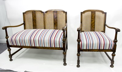 Lot 628 - A cane two-seater sofa and matching armchair...