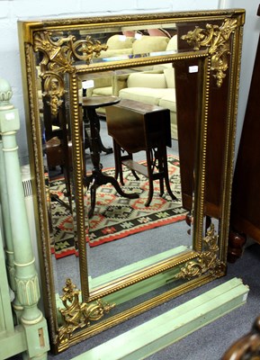 Lot 634 - A gilt framed wall mirror with spandrel...