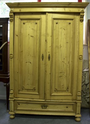 Lot 637 - A pine wardrobe, 128cm wide and the matching...