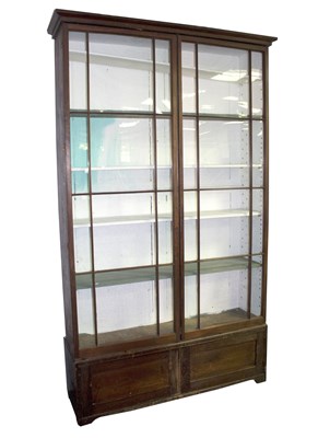 Lot 647 - A stained pine display cabinet, fitted...